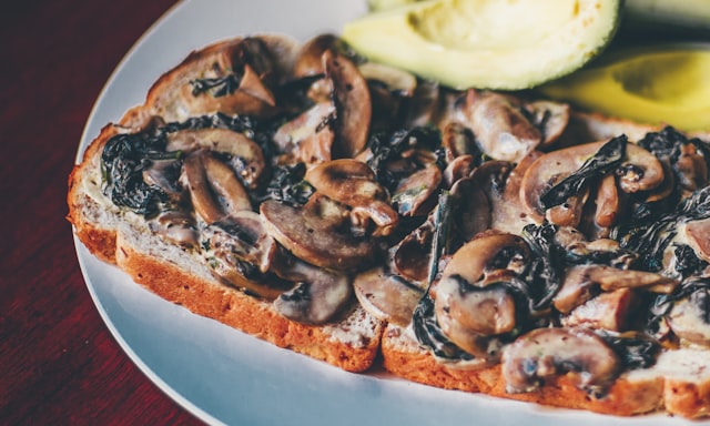 Mushroom toast on a ceramic plate